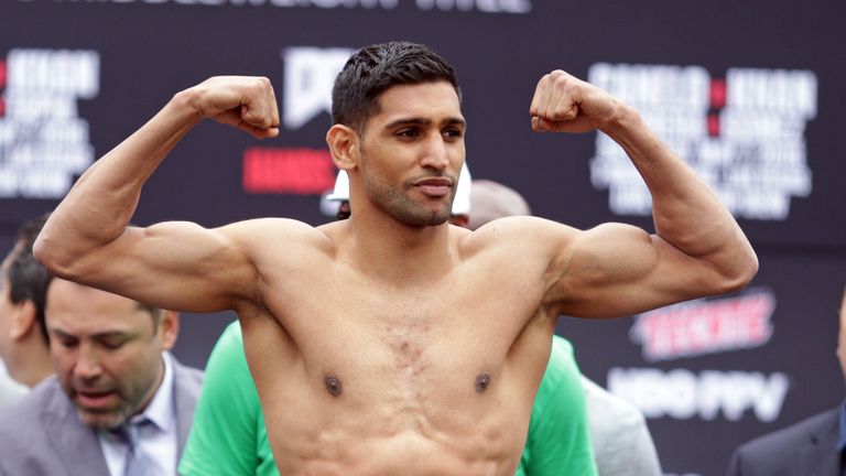 Amir Khan poses during the weigh-in for his clash with Saul Alvarez