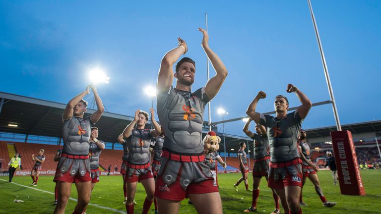 Leigh's Liam Kay leads the team to thank the fans for their support after defeating Bradford
