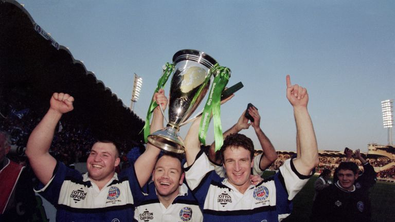 Bath rugby players Mark Regan, Ieuan Evans and Mike Catt celebrate their team's 19-18 victory over Brive in the 1998 Heineken Cup final