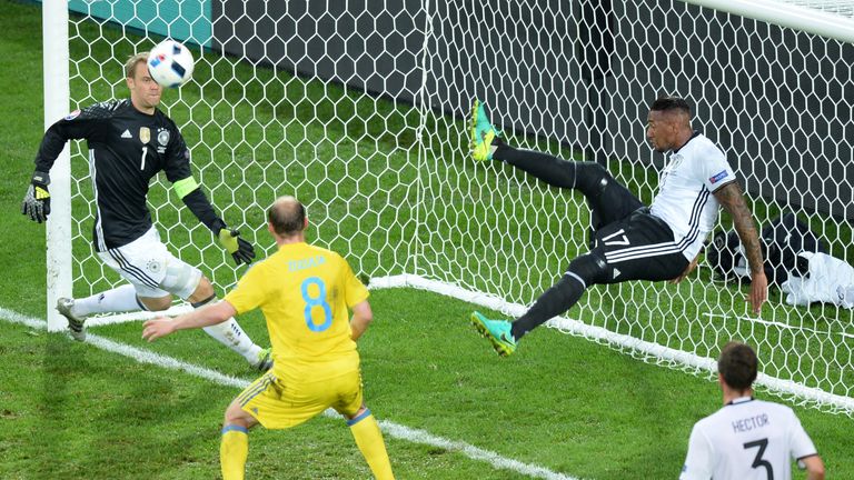 Germany's defender Jerome Boateng with an acrobatic clearance against Ukraine