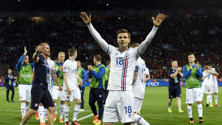 Iceland's Theodor Bjarnason (C) and his team-mates celebrate after the 1-1 draw
