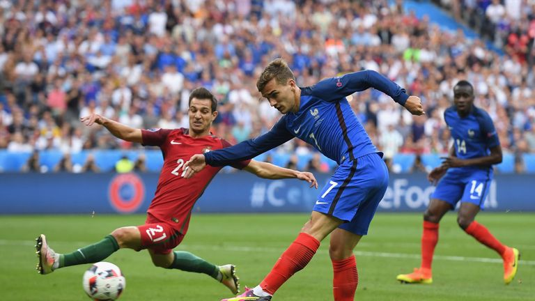 Antoine Griezmann shoots in the first half at the Stade de France