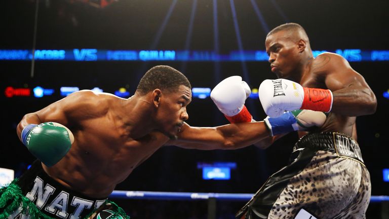 Danny Jacobs (left) punches Peter Quillin during their WBA middleweight championship bout