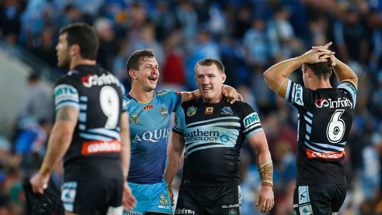 Greg Bird of the Titans and Paul Gallen of the Sharks embrace after the 18-all draw