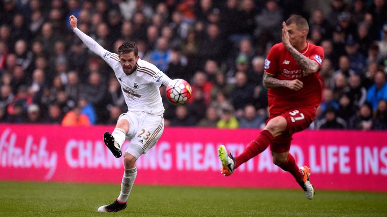 Sigurdsson gets in a shot at goal in last season's game against Liverpool