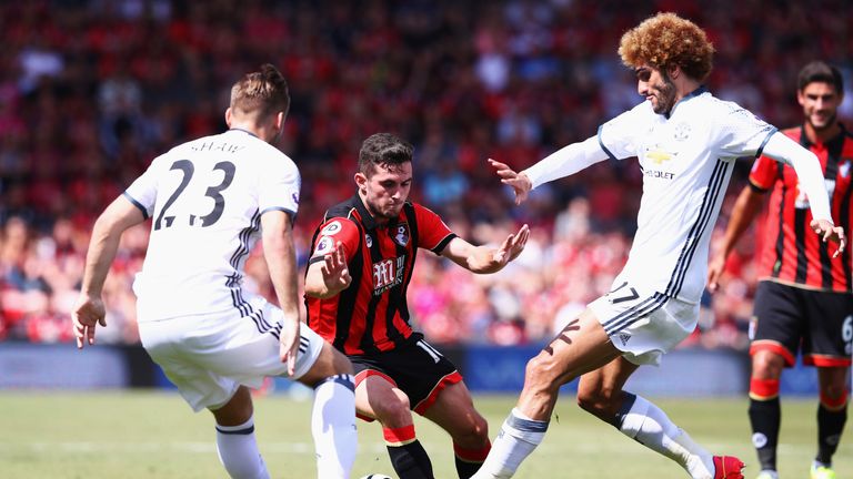 Lewis Cook takes on Luke Shaw (left) and Marouane Fellaini