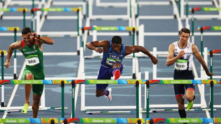 But Britain's Andrew Pozzi (right) misses out after a frustrating run in the men's 110m hurdles