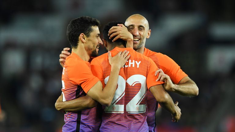 Gael Clichy of Manchester City celebrates scoring his side's first goal 