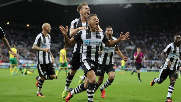 Gayle (centre) celebrates after scoring a late winner against Norwich as Newcastle win 4-3 at St James' Park