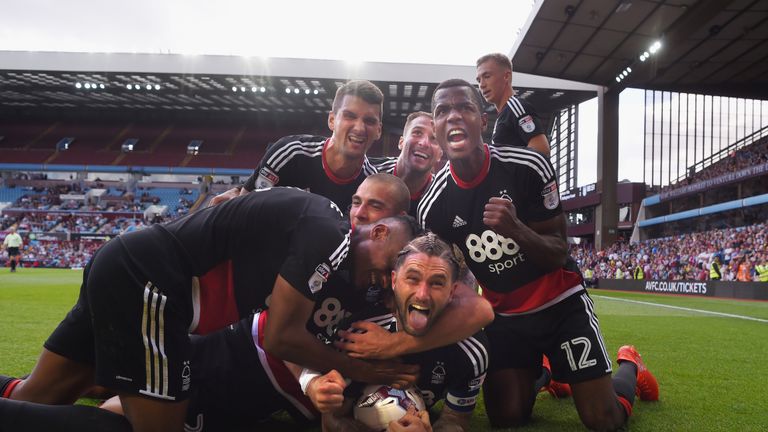Henri Lansbury celebrates his late equaliser against Aston Villa