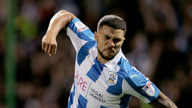 Huddersfield Town striker Nahki Wells takes on