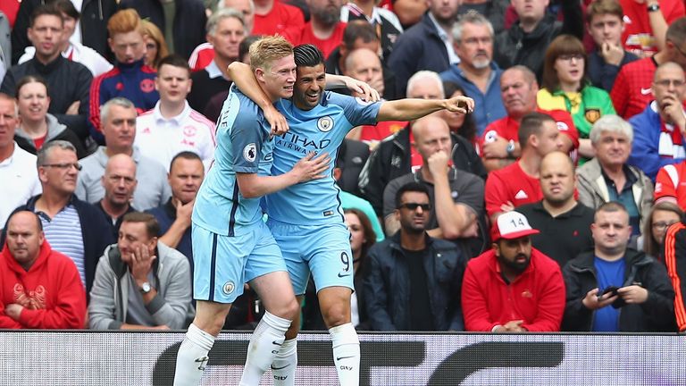 Kevin De Bruyne celebrates with Nolito after scoring the opener at Manchester Derby