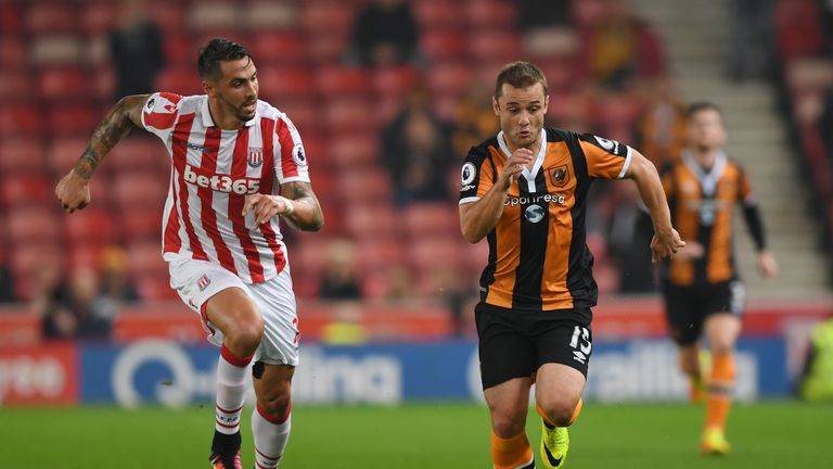 Hull's Shaun Maloney is tracked by Stoke's Geoff Cameron
