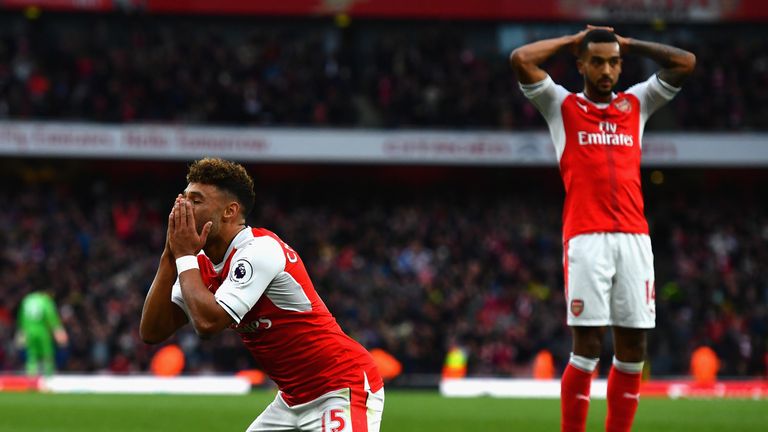 Arsenal's Alex Oxlade-Chamberlain and Theo Walcott show the strain against Boro
