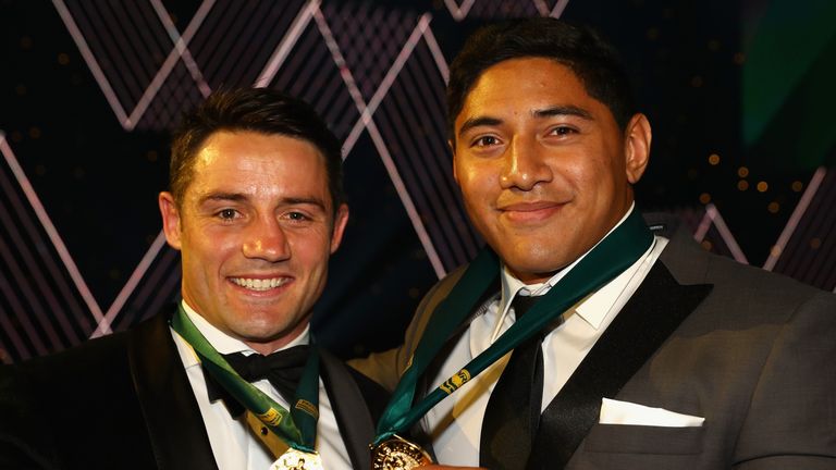 Cooper Cronk and Jason Taumalolo pose with the Dally M medals