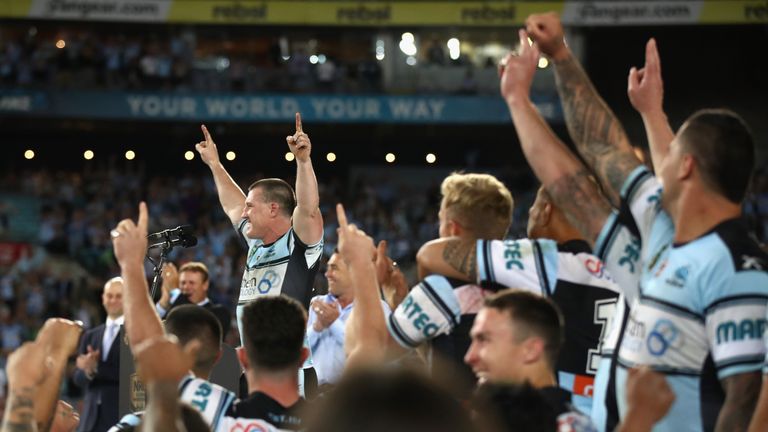Paul Gallen celebrates with team-mates after winning the 2016 NRL Grand Final
