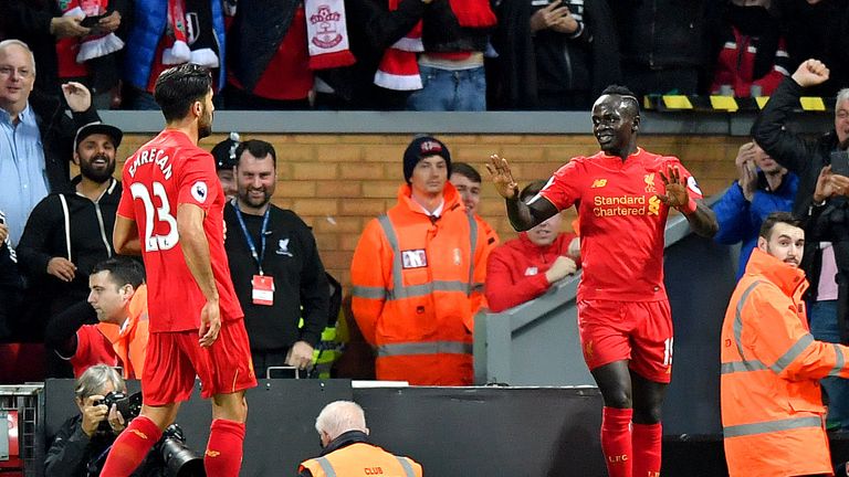 Liverpool's Sadio Mane (right) reacts after scoring his side's first goal of the game 