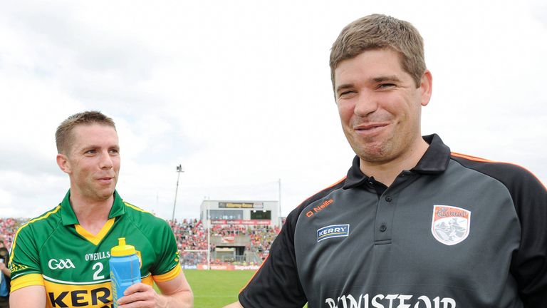 Eamonn Fitzmaurice shakes hands with Marc Ó Sé after Kerry's Munster final win over Cork in 2013