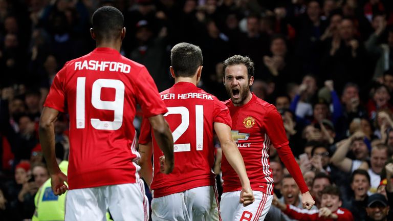 Manchester United's Juan Mata (right) celebrates after scoring his side's first goal 