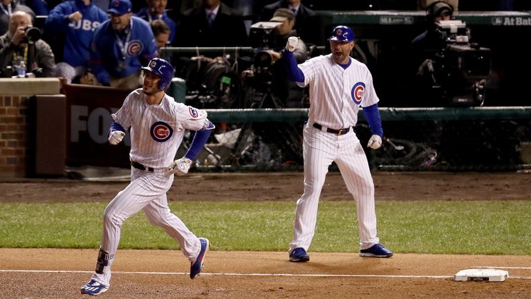 Bryant rounds the bases after hitting a home run in the fourth inning