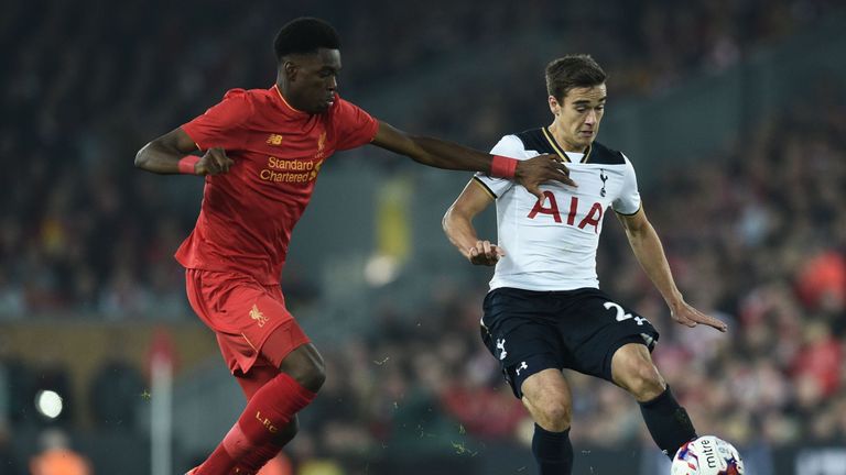Tottenham midfielder Harry Winks vies with Liverpool's Ovie Ejaria