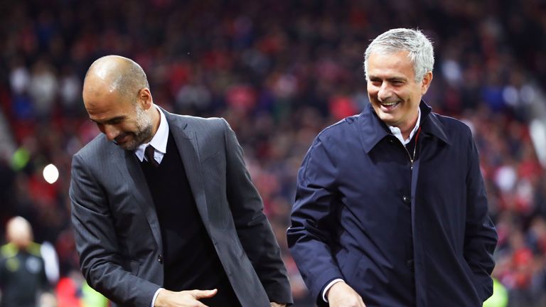 Pep Guardiola and Jose Mourinho share a joke at Old Trafford last year