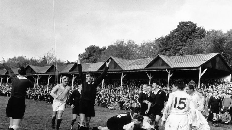Colin Meads (middle) celebrates a New Zealand try in October 1963