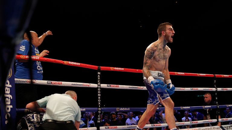 Sam Eggington celebrates after the referee calls a halt to proceedings