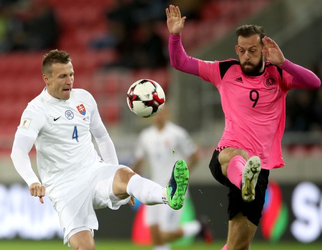 Jan Durica knocks the ball away from Steven Fletcher