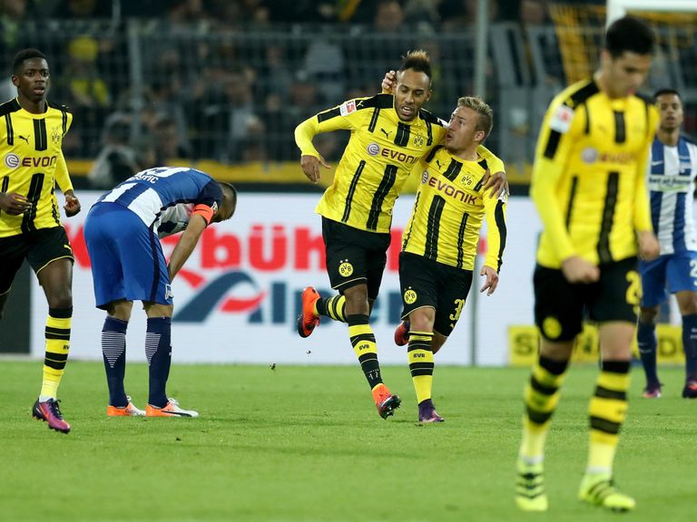 Pierre-Emerick Aubameyang is congratulated after scoring the equaliser for Borussia Dortmund 