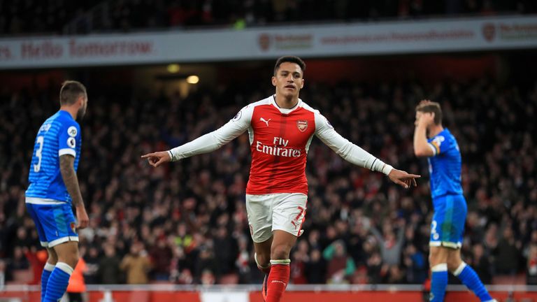 Sanchez celebrates scoring his side's third goal 