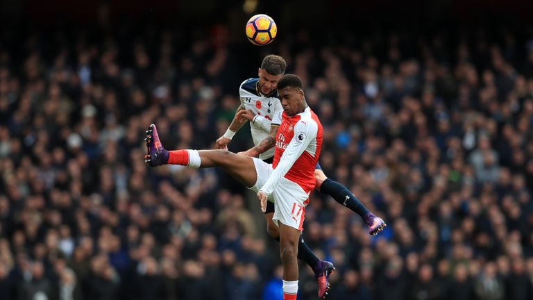 Tottenham Hotspur's Kyle Walker and Arsenal's Alex Iwobi battle for the ball in the air