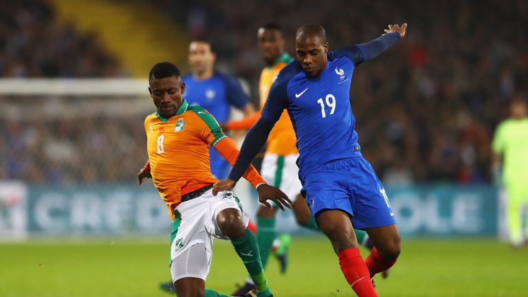 Ivory Coast forward Salomon Kalou (left) battles for the ball with France's Djibril Sidibe