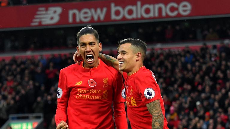 Roberto Firmino (left) and Philippe Coutinho (right) were on target against the Hornets at Anfield