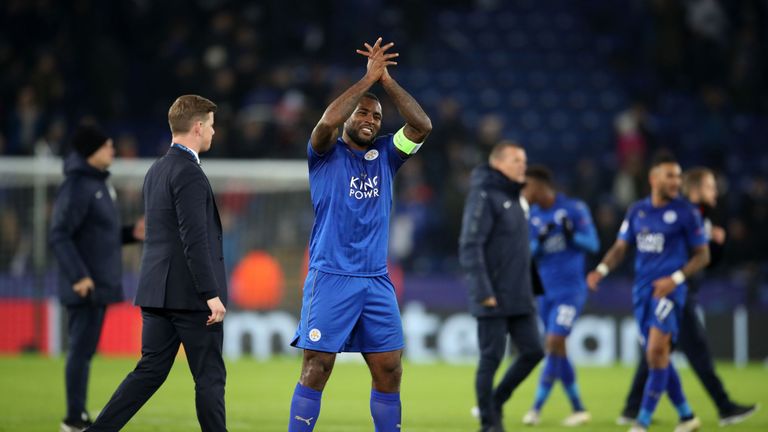 Wes Morgan celebrates their qualification at the King Power Stadium