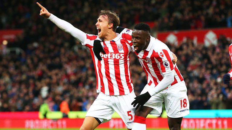 Marc Muniesa (left) celebrates his rare strike against Burnley