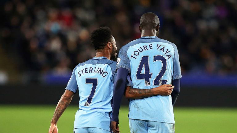 Toure celebrates his goal with team-mate Raheem Sterling