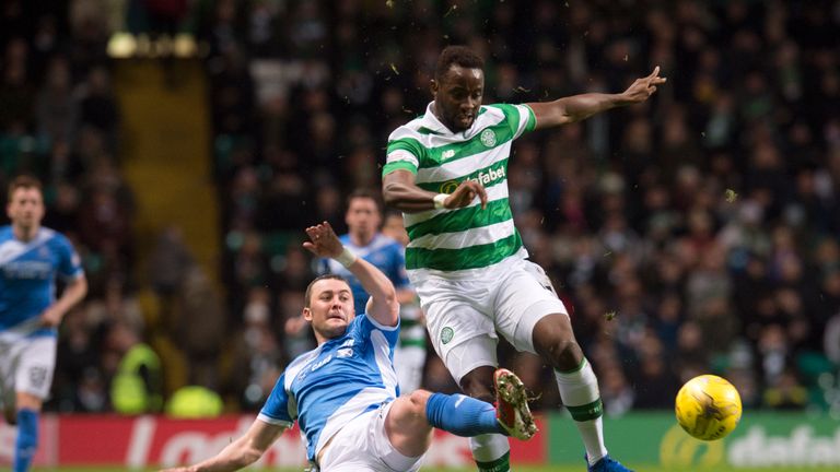 St Johnstone's Tam Scobbie (left) halts Moussa Dembele's progress