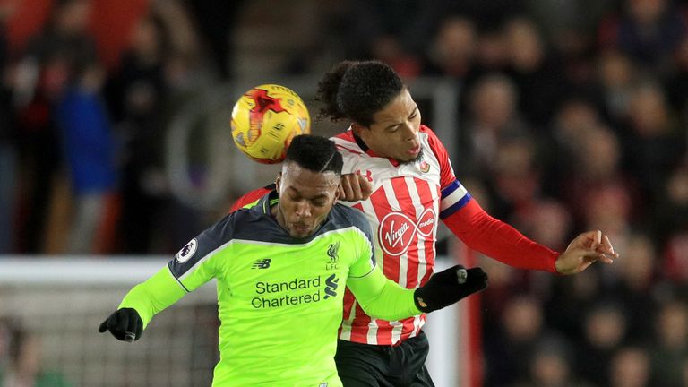 Daniel Sturridge battles for the ball with Vigril van Dijk