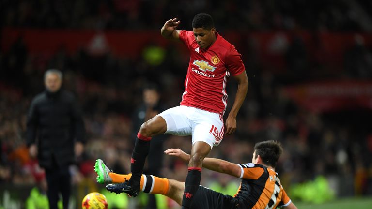 Marcus Rashford is challenged by Harry Maguire