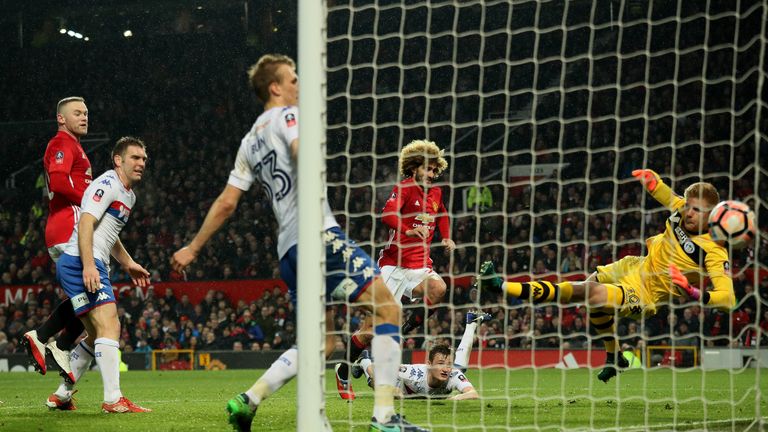 Marouane Fellaini rose above Callum Connolly to head home Manchester United's opening goal