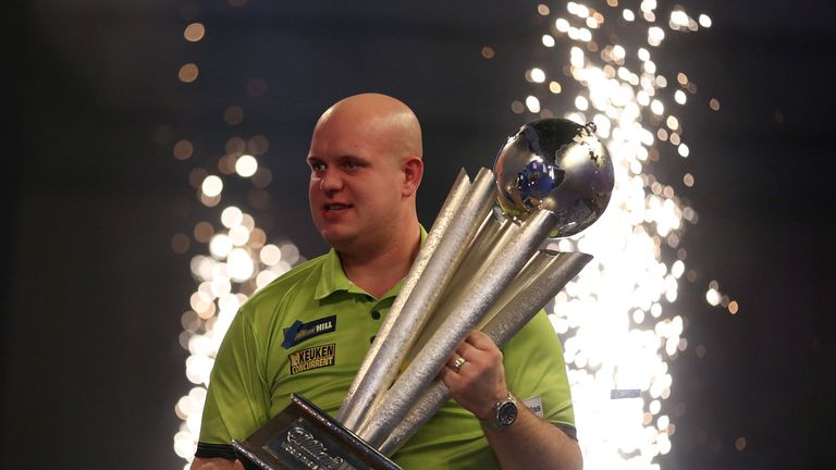 Michael van Gerwen holds the Sid Waddell trophy