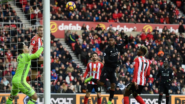 Daniel Sturridge of Liverpool (C) scores his sides first goal past Vito Mannone of Sunderland (L)