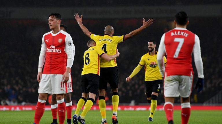 Younes Kaboul (C) of Watford celebrates scoring the opening goal 