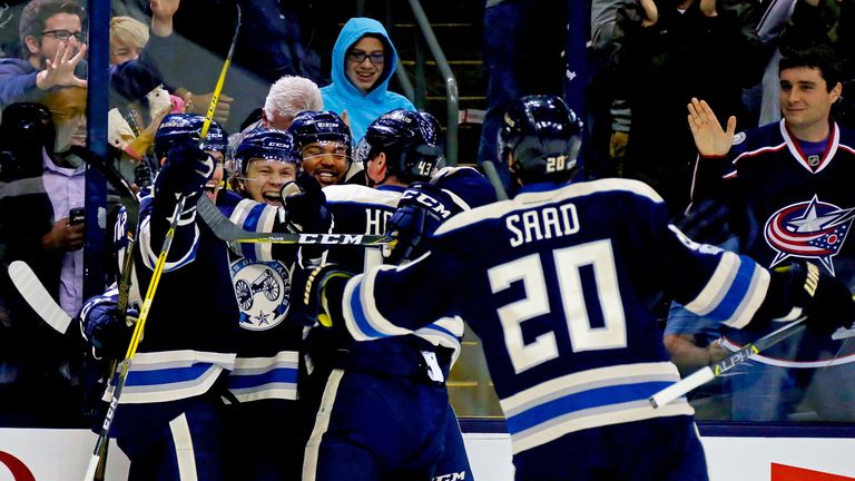 William Karlsson (2nd L) is mobbed by his team-mates after giving Columbus a 2-1 lead