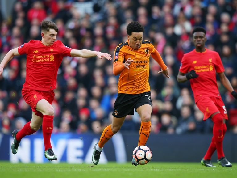 Helder Costa of Wolves takes on Ben Woodburn of Liverpool