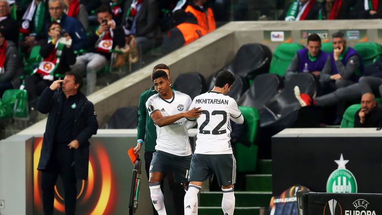 Henrikh Mkhitaryan of Manchester United leaves the field with an injury
