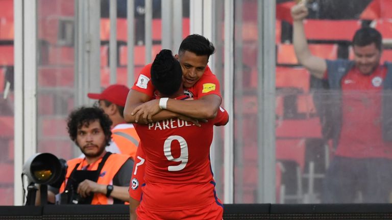 Sanchez celebrates with Chile team-mate Esteban Paredes after scoring against Venezuela in midweek