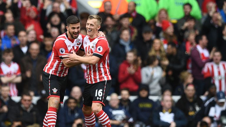 James Ward-Prowse celebrates with Shane Long after pulling a goal back for Southampton