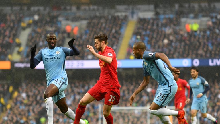 Lallana is closed down by Yaya Toure and Fernandinho